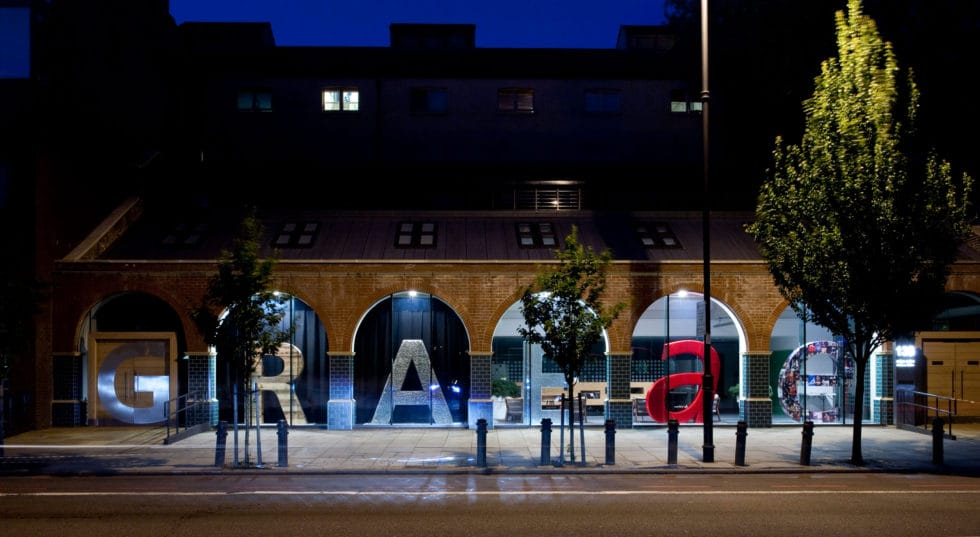 Bradbury Studios at night, windows with each letter showing through.