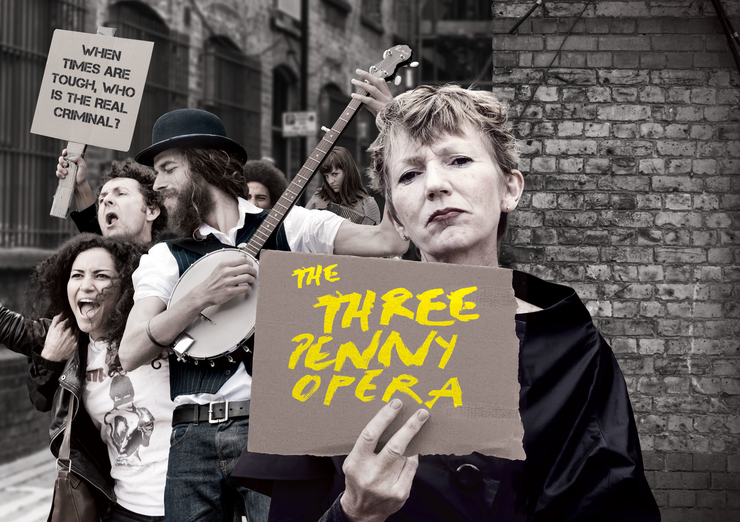 A woman stands and holds a sign that reads The Three Penny Opera. Behind her is a band of people, some holding instruments.