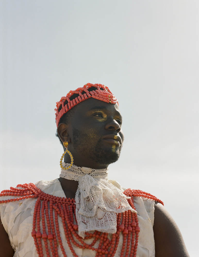 Sonny Nwachukwu wearing traditional clothing and a beaded headpiece.