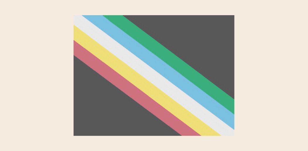 Disability Pride flag on a cream background. The flag features a dark grey background with five stripes crossing diagonally from left to right. Each stripe is a different colour.