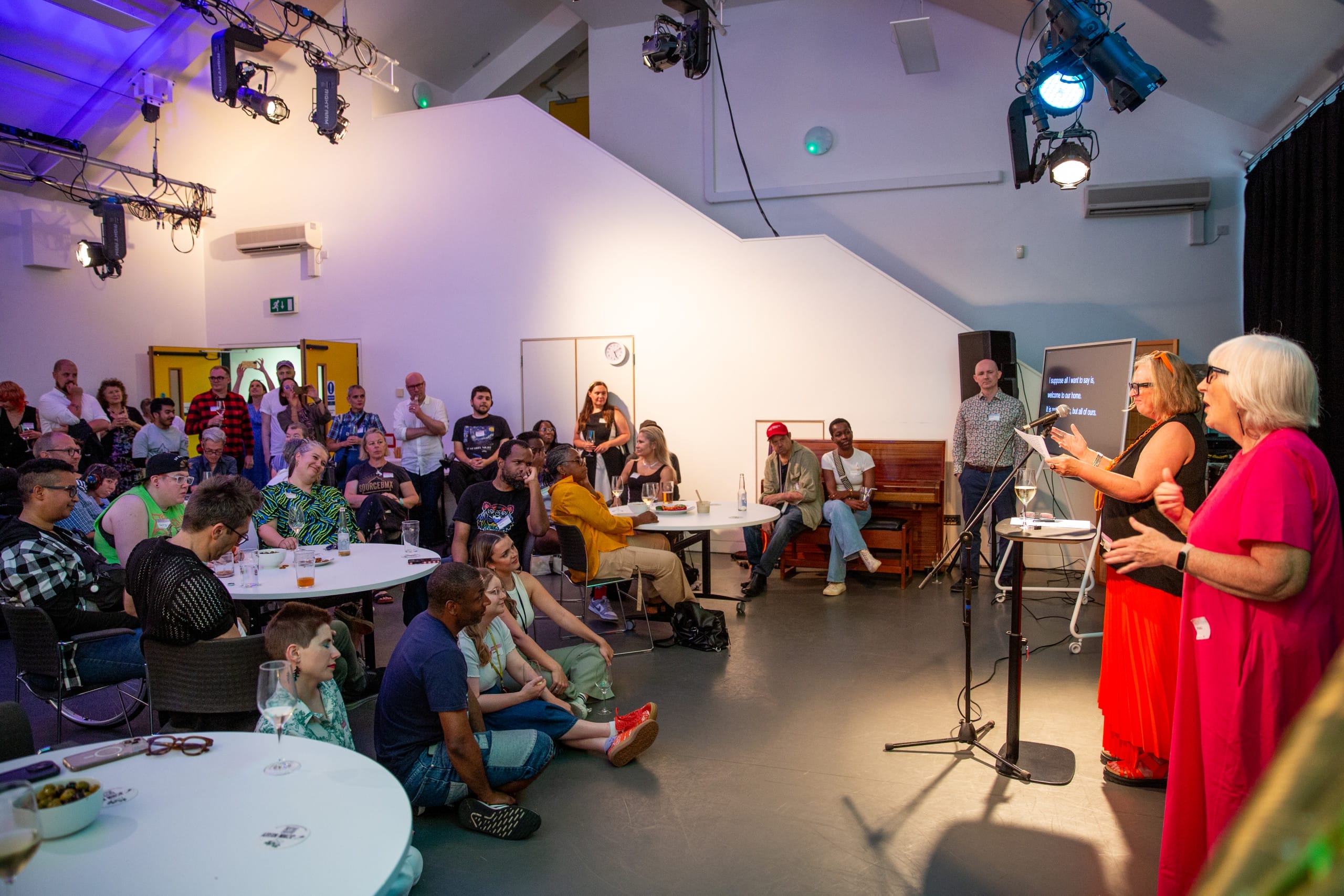 Jenny Sealey speaking to a room full of people at Graeae
